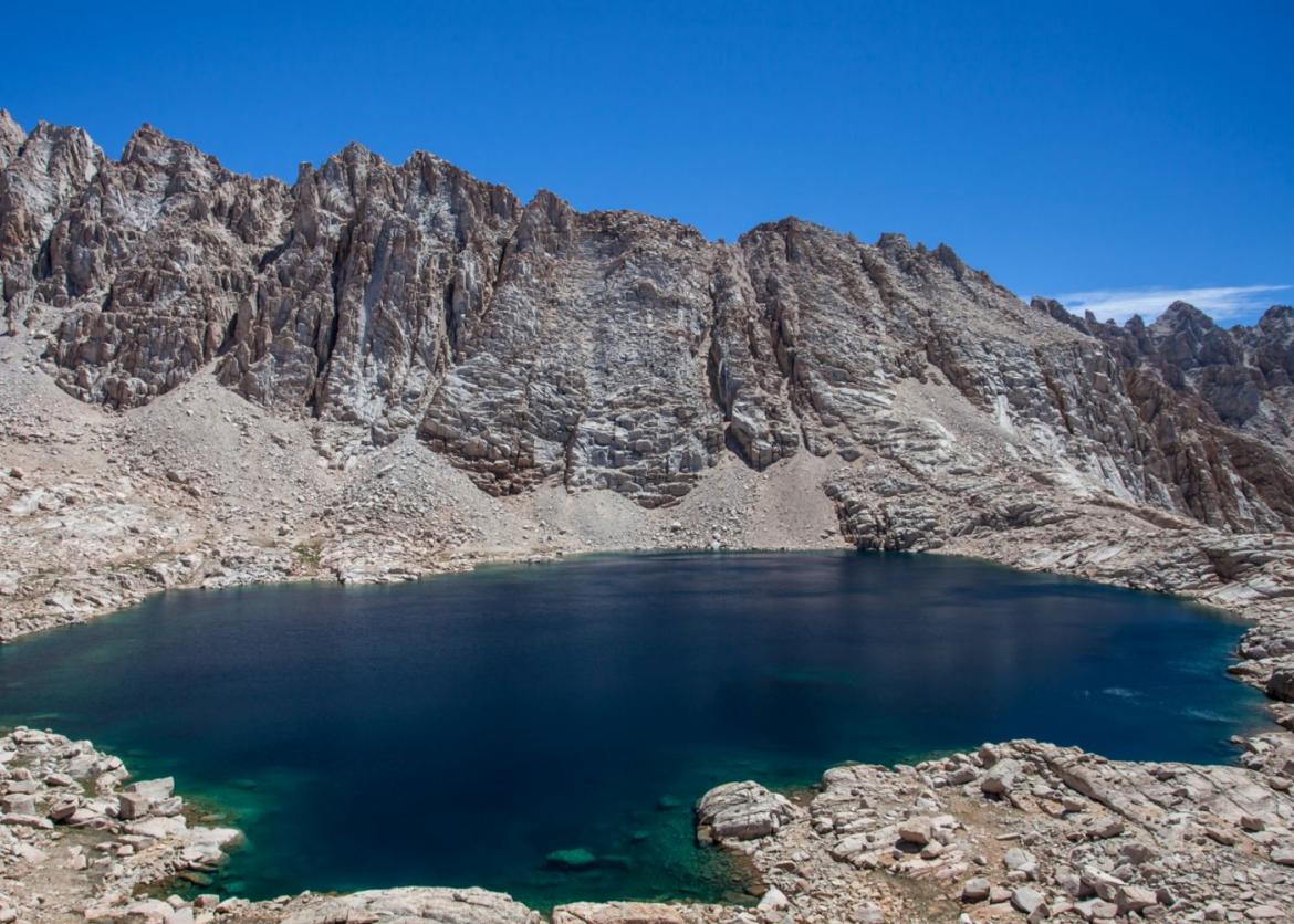 Rocky mountains and turquoise blue lake in California's Sierra mountains