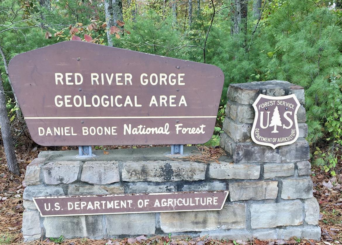 An entrance sign that says "Red River Gorge Geological Area".