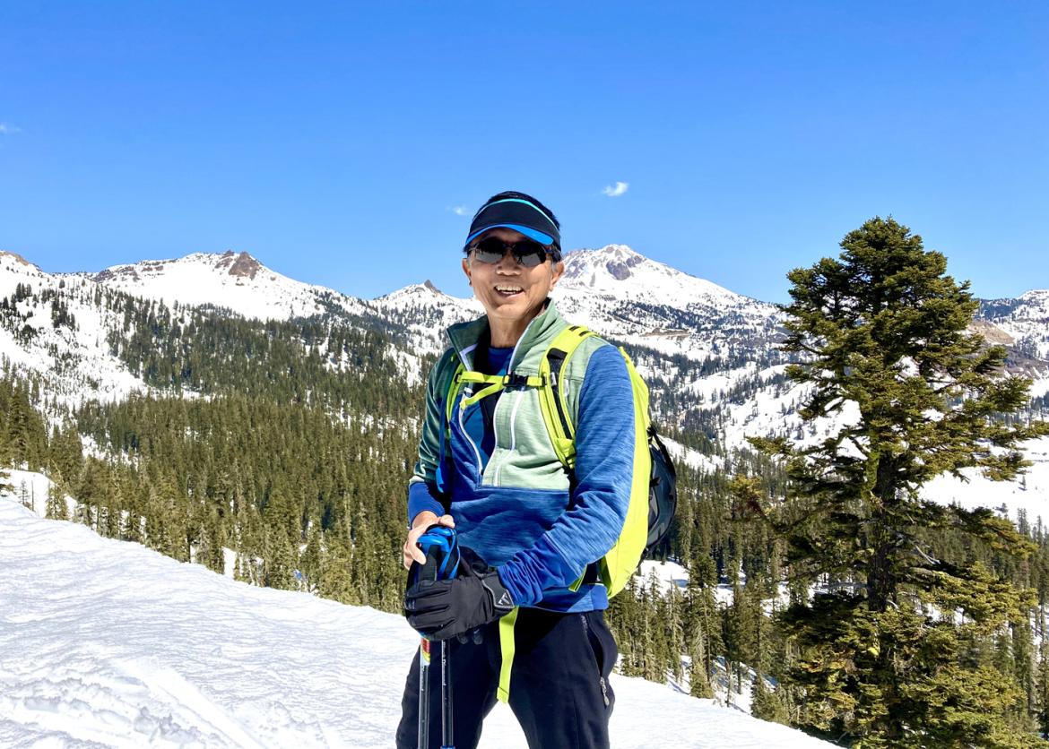 Man smiling while backcountry skiing at Lassen Volcanic National Park, California