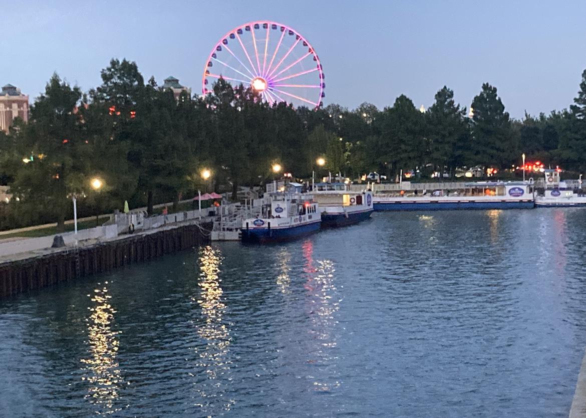 View of the Chicago river and ferris wheel at dusk