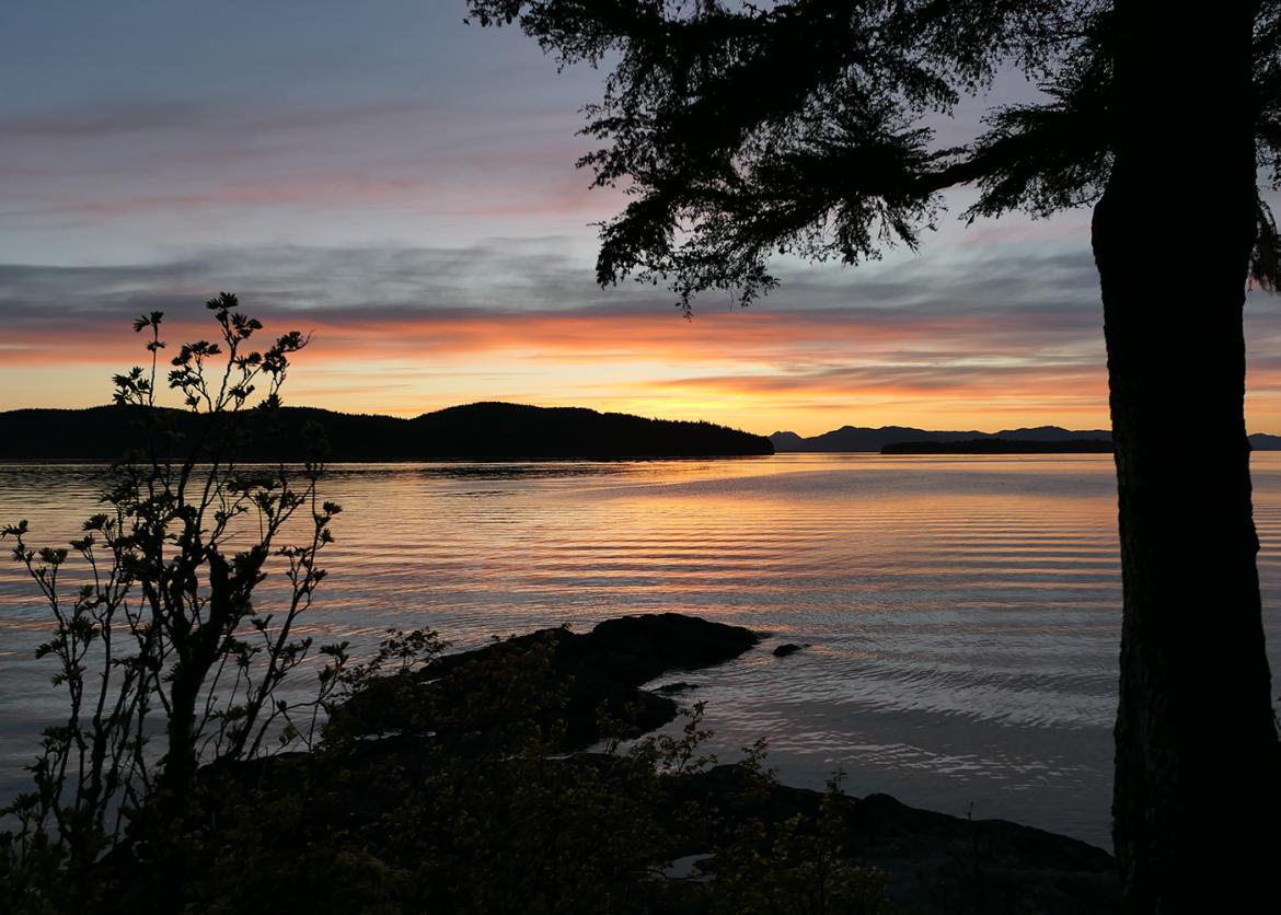 A sunset over the sea and landscape near Ketchikan, Alaska