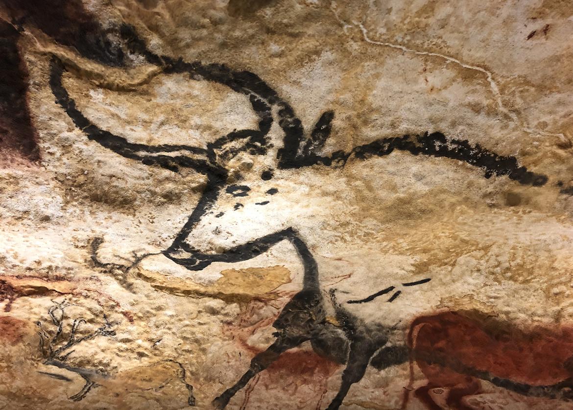 A cave painting of a long horned cow.