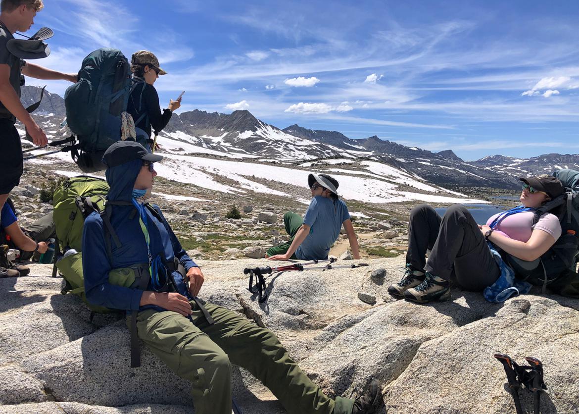 Trip participants take a break on the backpacking trail