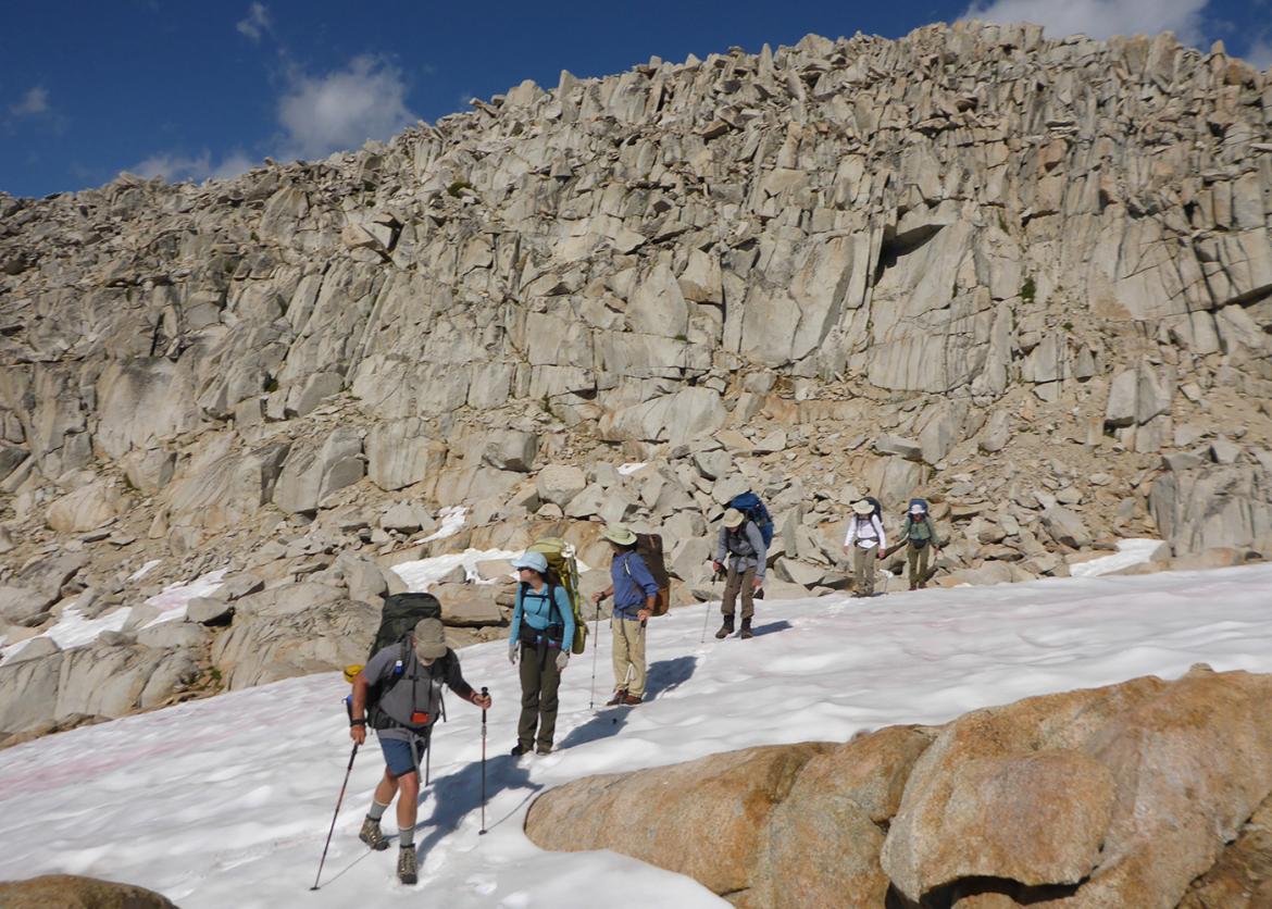 Trip participants hike through snow