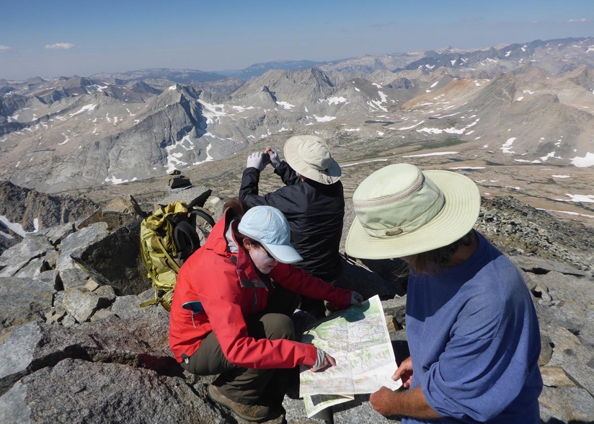 Trip participants consult a map.