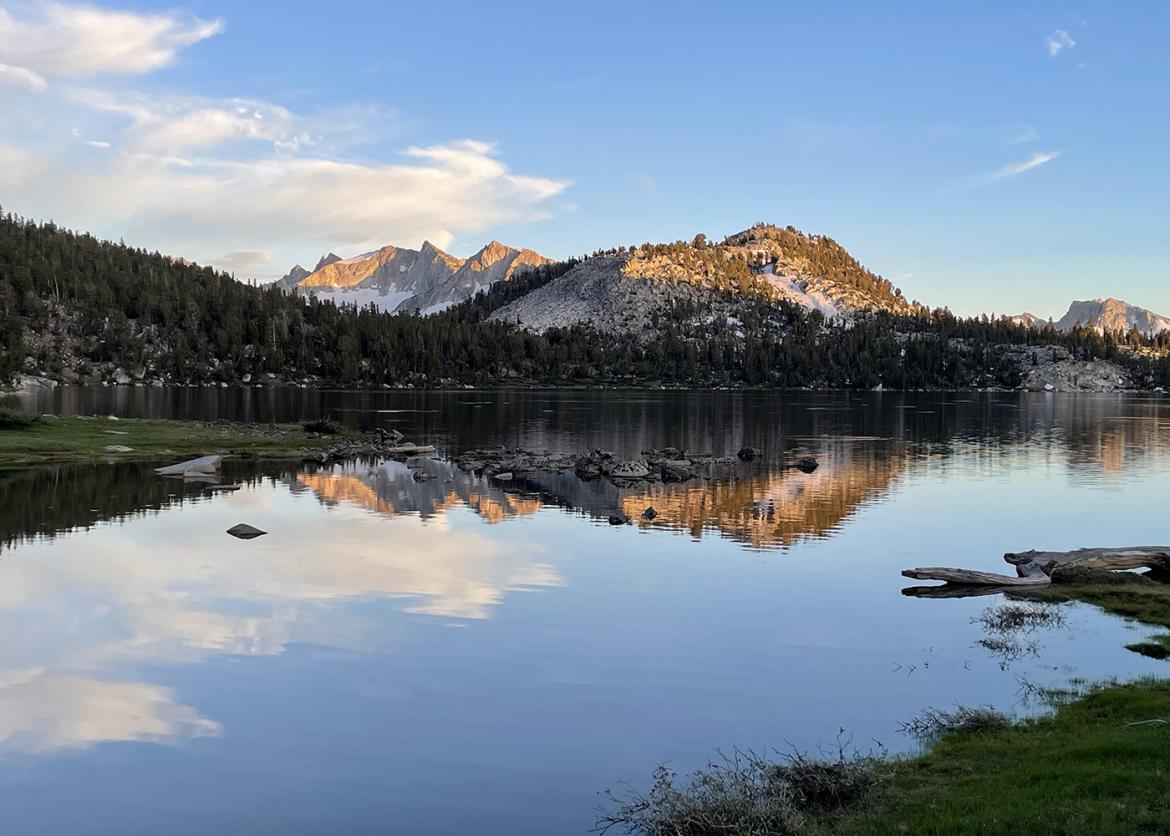 Reflective lake in front of Sierra mountain peaks