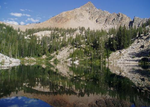 A jagged mountain above a lake.